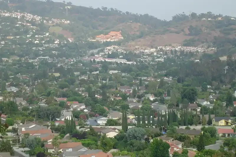 Homes spread across the Puente Hills slopes in Hacienda Heights, with Hsi Lai Temple on the hillside